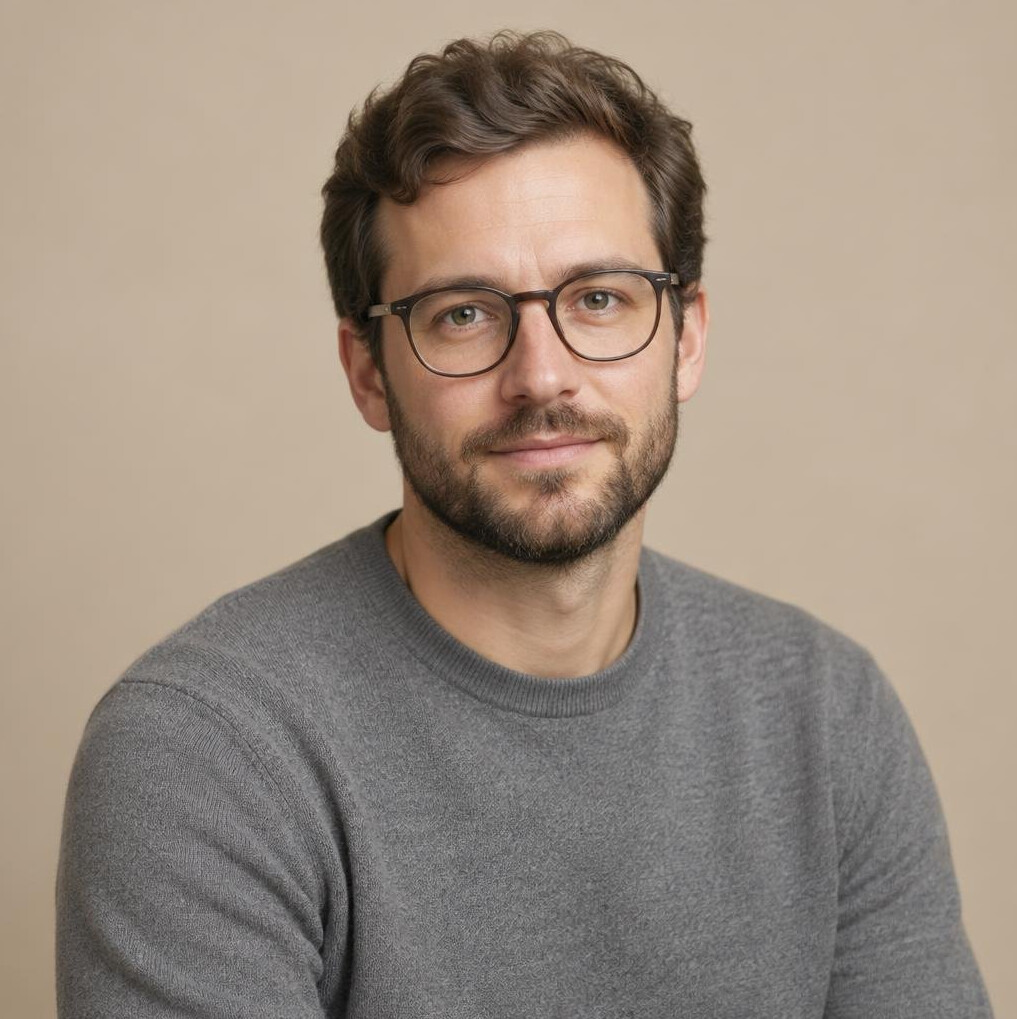 Studio portrait of a Swiss man colourist with glasses